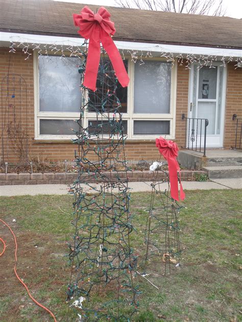 Use lots of lights to help cover the wire and make a bright display. . How to make a rag tree using a tomato cage
